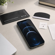 Apple iPhone 12 Pro HD Clear hydrogel screen protector – fitted phone and installation accessories on a workspace